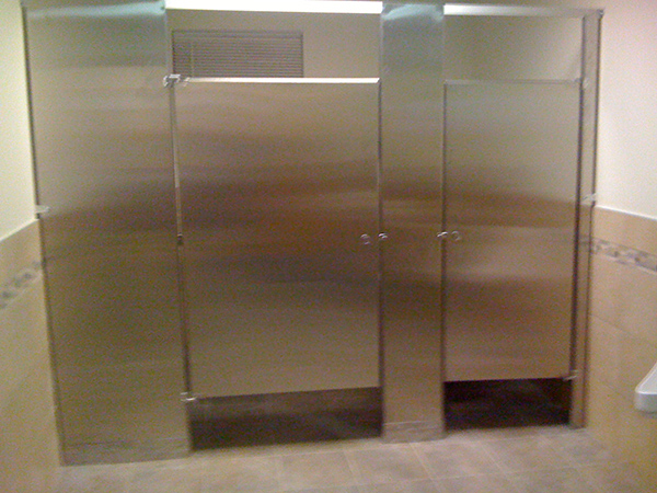 New stainless-steel restroom partitions after the remodel